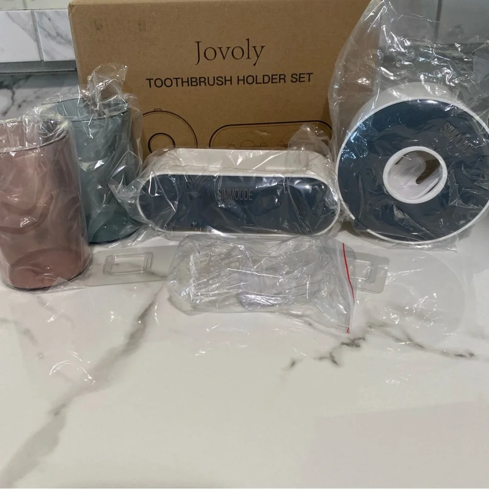 Wall mounted toothbrush holder and tooth paste dispenser with  mouthwash cups
